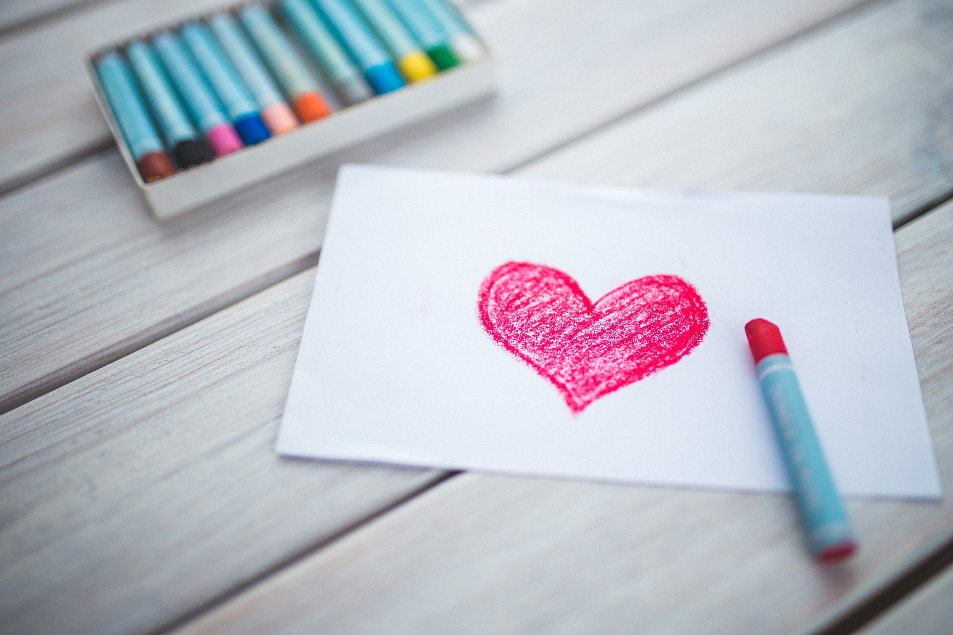 heart drawn on paper with crayons